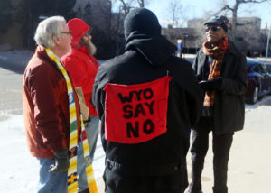 Juntos Chairman Antonio Serrano visits with Highlands United Presbyterian Pastor Rodger McDaniel, Jason Bloomberg and Mohamed Salih, from left, during a Juntos prayer vigil in front of the United States Immigration and Customs Enforcement office on Monday, Jan. 15, 2018, in Cheyenne. Around 50 people attended the vigil to show their opposition to an ICE detention center proposed for Evanston. Blaine McCartney/Wyoming Tribune Eagle